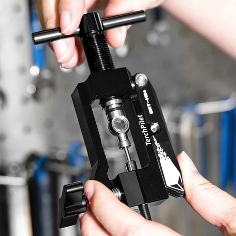 Hydraulic Brake Hose Fitting Kit With Insert Needle Driver Olive And Banjo Head Press Tool For Clean Cuts Pro Grade DIY Ready Mineral Brake Line Cutter All In One Repair Set Black in use, close-up view, showing cutting action.
