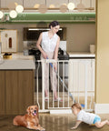 Walk Through Pressure Mounted Baby Gate For Narrow Openings 24.2 To 29 Inches Wide, woman with mop, baby, and dog nearby