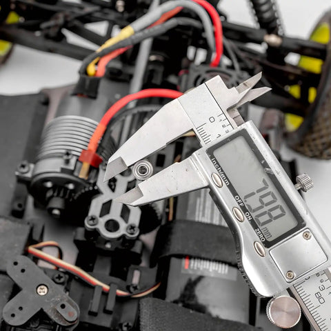 Caliper measuring sealed deep groove ball bearing 3 by 8 by 4 millimeter in RC car model