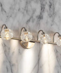4 Light Brushed Nickel LED Vanity Light With Acrylic Shades Dimmable 3000K To 6000K Wall Lamp on marble backdrop