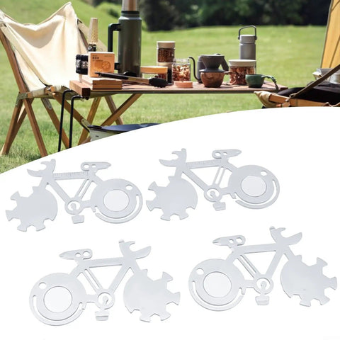 Four stainless steel Bike Shaped 14 In 1 Pocket Multitool Cards with camping setup in background