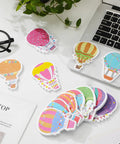 Colorful Hot Air Balloon Sticky Notes Pack Of 12 Styles With 50 Sheets Each on desk with laptop and plant