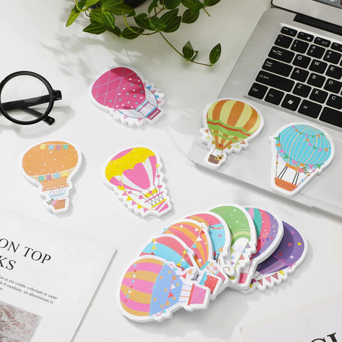 Colorful Hot Air Balloon Sticky Notes Pack Of 12 Styles With 50 Sheets Each on desk with laptop and plant