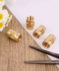 Four Pack One Eighth Inch NPT Brass Female Pipe Fitting Couplers Hex Head Threaded Connectors For Plumbing, Shower, Gas, Hydraulic And Pneumatic Systems For Various Applications, shown with four brass couplers