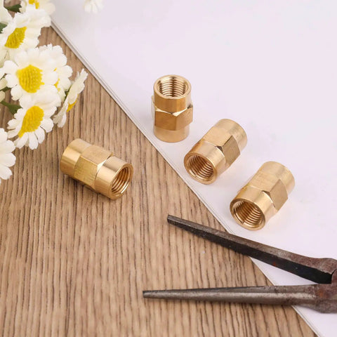 Four Pack One Eighth Inch NPT Brass Female Pipe Fitting Couplers Hex Head Threaded Connectors For Plumbing, Shower, Gas, Hydraulic And Pneumatic Systems For Various Applications, shown with four brass couplers