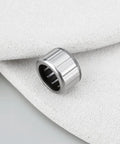 Drop In One Way Roller Clutch Bearing Replacement 6J540401 J54 0401 for Daiwa fishing reels on white textured surface