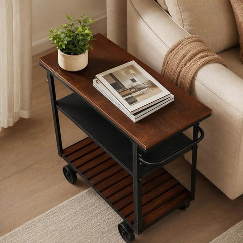 Smooth Rolling Three Tier Bar Cart With Sturdy Handle And Mobile Kitchen Microwave Rolling Stand With Chic Industrial Beverage Serving Design In Rustic Brown Metal And Wood, top view with plant and books.