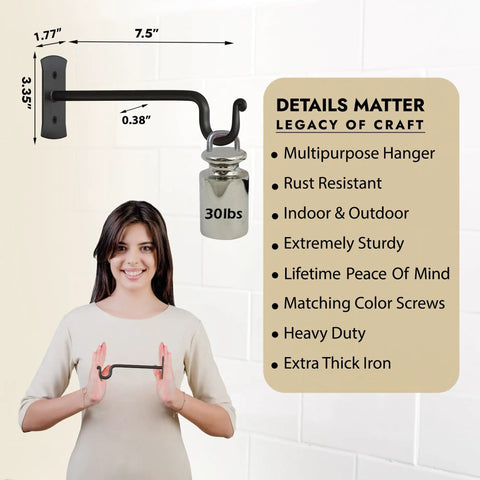Heavy Duty Wrought Iron Plant Hanger Set Of Two For Indoor Or Outdoor Use Metal Wall Bracket Hooks Next to Smiling Person Showing Design