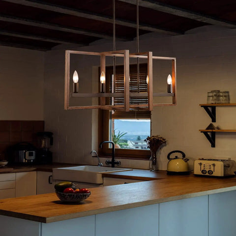 Modern Farmhouse Chandelier for Dining Room and Living Room over a kitchen island, wood grain finish, lit candles create ambiance.