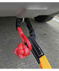 4x4 Recovery Soft Shackle Set 2 Pack With Protective Sleeve And Floats Flexible Synthetic Cable attached to vehicle