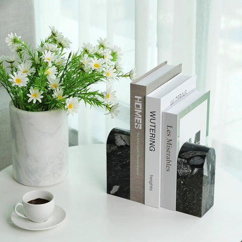 Sturdy Marble Book Ends Set Weighing 7lbs With Non Slip Pads For Stable Shelf Display shown with books on a white table