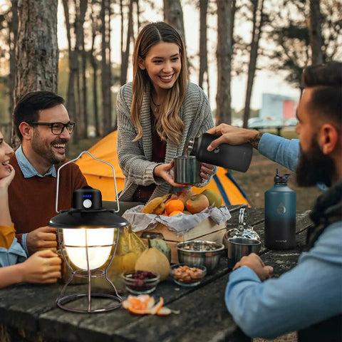 Group enjoying outdoor meal with Legit 64 Oz Insulated Water Bottle Triple Wall Vacuum Stainless Steel used for hydration.
