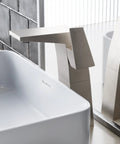 Single Hole High Arc Bathroom Faucet With One Handle Brushed Nickel Finish Solid Brass Build One Point Two GPM Flow shown in modern bathroom.