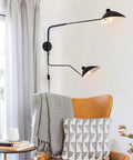 Retro Dope Plug In Wall Sconce With Swivel Arm And Adjustable Head in living room setting with chair and decor