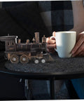 Locomotive Model Retro Steam Train Sculpture For Desktop Decoration next to a coffee cup, showcasing vintage style and detail.