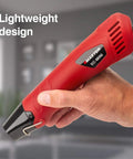 Hand holding EC-MINI Pro Grade Heat Gun For Crafts And DIY Projects With Shrink Wrap And Reflector Attachment, red design