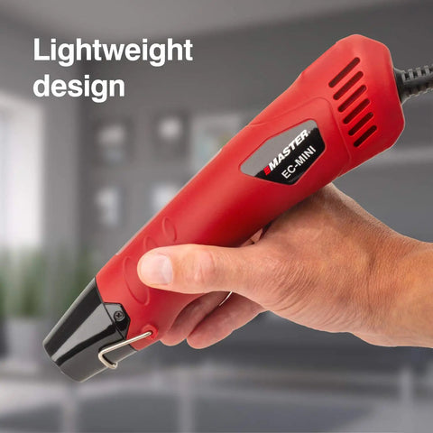 Hand holding EC-MINI Pro Grade Heat Gun For Crafts And DIY Projects With Shrink Wrap And Reflector Attachment, red design