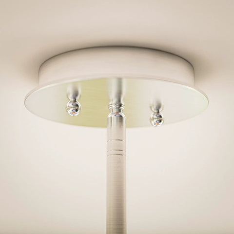 Ceiling mount of Bulletin 3 Light Pendant With Cork Shade In Brushed Steel Finish Delivers Modern Ambient Lighting That Looks Clean And Dope For Kitchen Islands, Dining Areas, And Living Rooms.
