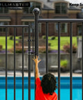 Heavy Duty Auto Pool Gate Latch With Snappy Spring Closer And Easy Push Release For Child Safe Chain Link Fences, black metal latch in use.