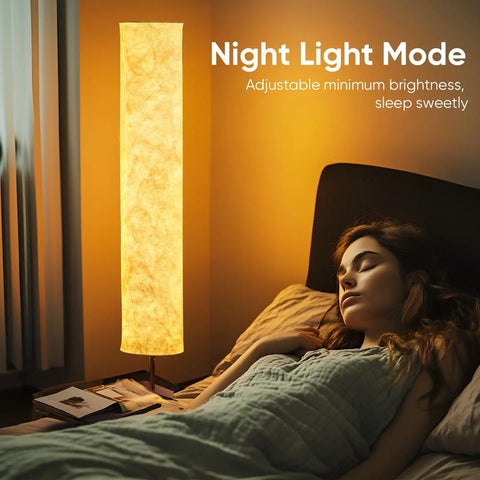 Woman sleeping beside 58 Inch Modern Floor Lamp With Tyvek Shade Warm White LED 3000K Slim Standing Light For Living Room Bedroom Game Room Marble Textured White Shade Cozy Ambience Eye Friendly Glow Contemporary Home Decor