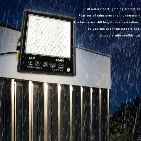JUDYSSY 6500K Led Floodlight Outdoor, 400W white LED security light mounted in rain, showcasing IP68 waterproof features.