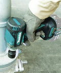 Person using 18V LXT Brushless Cordless One Half Inch Impact Wrench With Friction Ring Anvil Tool for heavy duty job
