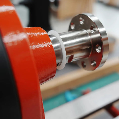 Close-up of Pack Of Six Slick Anti Lock Spindle Washers tailored for 1-1/4 Inch Woodlathe Threads on a lathe.