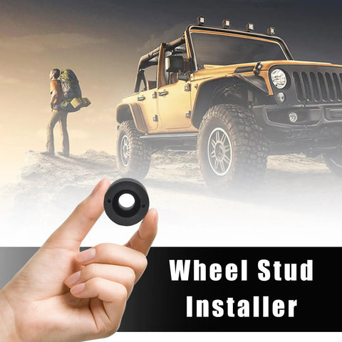 Close-up of a hand holding Wheel Stud Installer Tool for Cars and Light Duty Trucks with an off-road vehicle in the background.