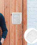 Waterproof Doorbell Rain Cover For Time Attendance And Fingerprint Devices PVC Protective Weatherproof Cover mounted on wooden door