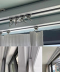 Heavy Duty Aluminum Alloy Curtain Tracks Providing Hella Smooth Tracking with wheeled gliders above sheer curtains.