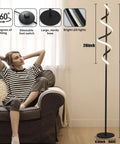 Tall Black Spiral Torchiere Floor Lamp With Remote Dimming And Color Changing LED, 63 Inch Tall beside a seated person