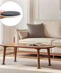 Heavy Duty Furniture Sliders 8 Pack Moving Pads for Hardwood Floors and Carpet under a coffee table in a living room.
