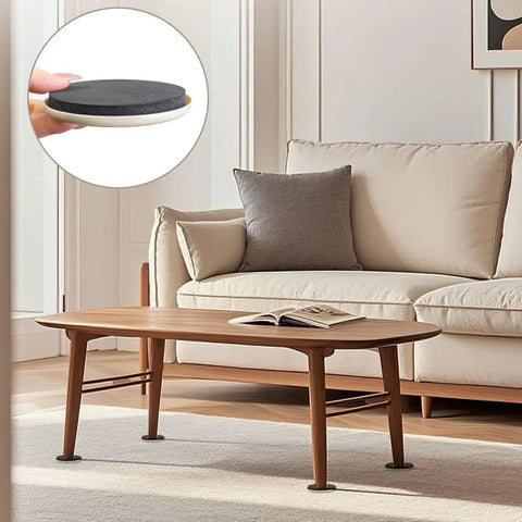 Heavy Duty Furniture Sliders 8 Pack Moving Pads for Hardwood Floors and Carpet under a coffee table in a living room.