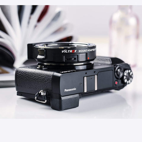 Canon EF To Micro Four Thirds Focal Reducer Booster Adapter 0.71x on Panasonic camera body, side view