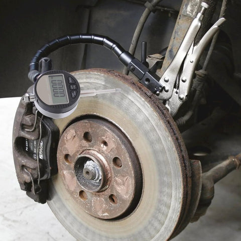 DXphita disc brake rotor runout gauge set with 1'' digital indicator and 360° flexible stem mounted on brake rotor (front view).