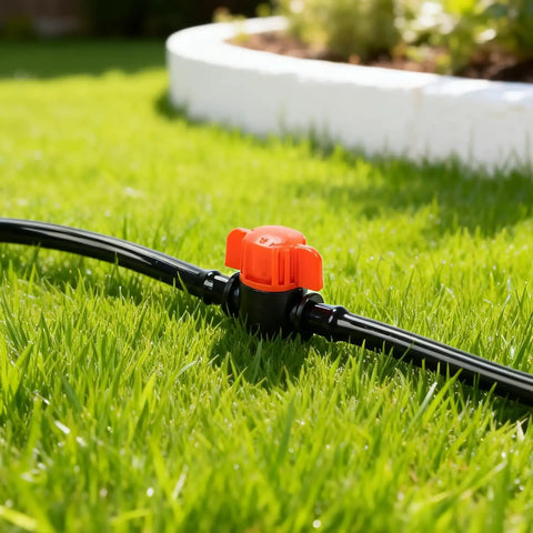 Close-up of a 25 Pack One Quarter Inch Drip Irrigation Shut Off Valve Easy Install Inline Water Flow Control on grass