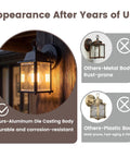 Built Tough E26 Outdoor Porch Light For Home Exterior Wall Matte Black Die Cast Aluminum And Clear Glass Wall Lantern mounted on wood.