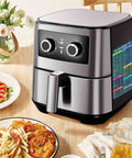 Air fryer on kitchen table with air fryer cooking times magnet set with 100 plus foods guide attached on side