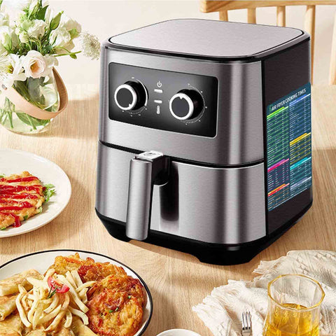 Air fryer on kitchen table with air fryer cooking times magnet set with 100 plus foods guide attached on side