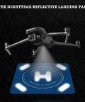 Nighttime Reflective Drone Landing Pad with glowing lights in dark, drone hovering above, Fast Fold Double Sided Waterproof Landing Mat