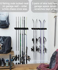 Magnetic Fishing Rod Holder Set For Garage And Truck Surfaces Portable Dual Pack holding fishing rods and skis on wall.