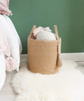 Dope Natural Rope Woven Storage Basket With Wooden Bead Handles Macrame Organizer For Blankets, Toys, Clothes, Shoes And Plants Indoor Home Decor Bin In Brown 28x28 Cm with blankets inside beside a bed