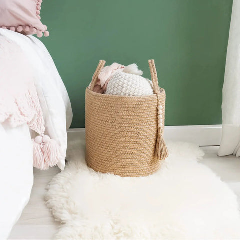 Dope Natural Rope Woven Storage Basket With Wooden Bead Handles Macrame Organizer For Blankets, Toys, Clothes, Shoes And Plants Indoor Home Decor Bin In Brown 28x28 Cm with blankets inside beside a bed