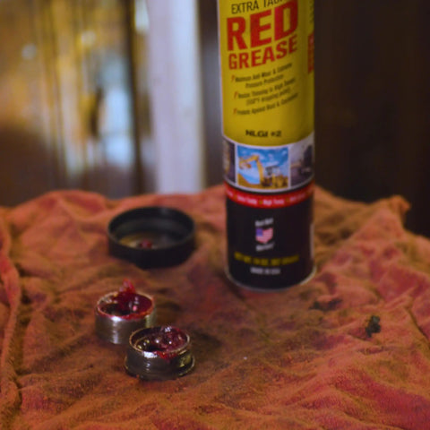Extra-Tacky Lithium Grease With Time-Release Penetrating Action For Superior Lubrication And Protection can and lid on rag