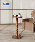 Round Walnut Wood Side Table With Solid Wood Columns, Ultra Sturdy Mid Century Modern Drink Table For Living Room shown near sofa