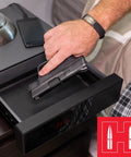 Person using nightstand gun safe with RFID reader clock and USB ports for fast touch free access discreet pistol safe