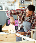 Man using Pink Go To Cordless Drill Kit With 20V Battery And Charger 30 Nm Torque 21 Plus 1 Clutch Three Eighths Inch Keyless Chuck LED Light Driver Bits Included for woodworking project