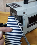 Professional Grade 220W Electric Scissors Sharpener That Crushes Dull Blades And Delivers Razor Sharp Results For Tailors And Seamstress Pros Seeking A Steady Workhorse To Keep Their Tools Sickly Sharp Daily with fabric cutting in progress.