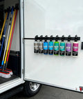 Rock Solid Wall Mounted Trigger Bottle Holder Rack For Garage Workspace And Mobile Detailing Cart With Heavy Gauge Coated Steel Frame Keeps Supplies Tidy And Makes Refills A Snap, holding eight bottles in a mobile detailing cart.