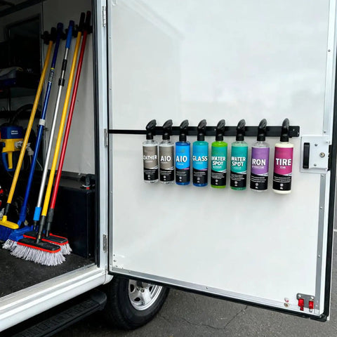 Rock Solid Wall Mounted Trigger Bottle Holder Rack For Garage Workspace And Mobile Detailing Cart With Heavy Gauge Coated Steel Frame Keeps Supplies Tidy And Makes Refills A Snap, holding eight bottles in a mobile detailing cart.